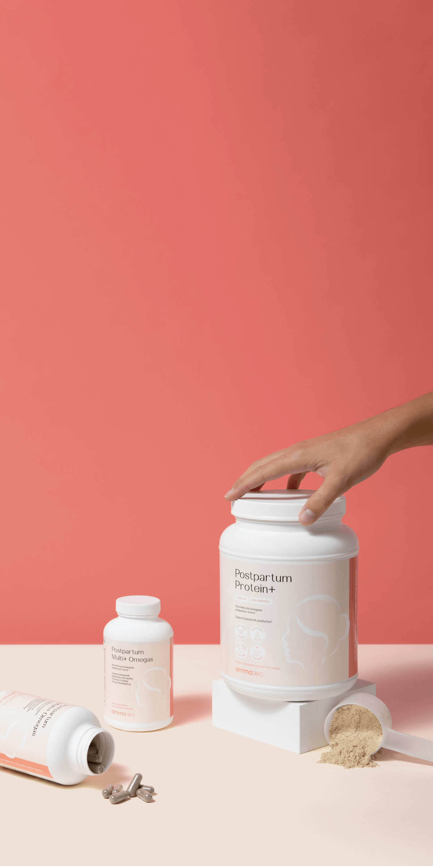 Postpartum product bundle image with hand holding product and capsules poured out on tabletop