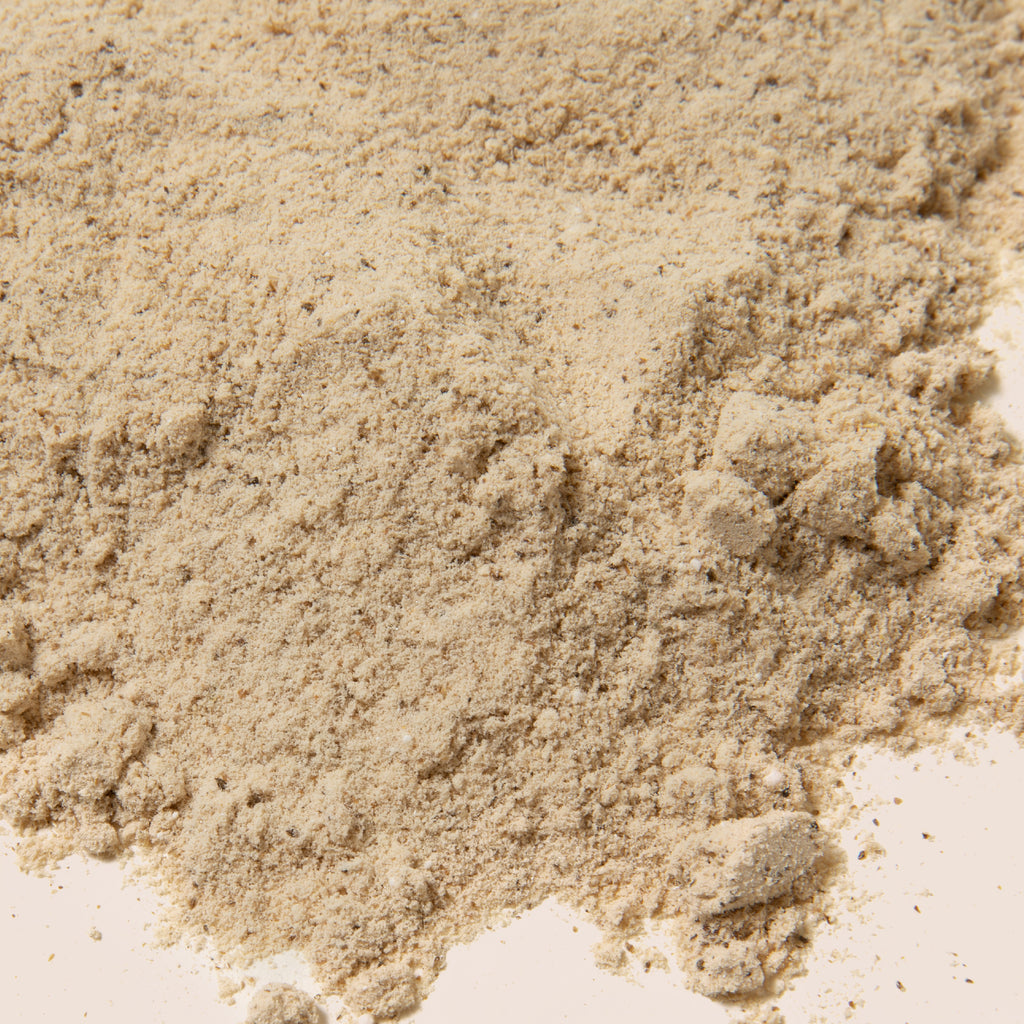 Product photo: Postpartum Protein+ close up of powder. Product photo: Postpartum Protein+ powder shown in scooper in hand of model. Vanilla flavor. 20 grams of protein per serving. Nourishes and energizes postnatal moms. Supports breastmilk production. Plant based formula. Third  party tested. Dairy free. Gluten free. Soy free. No fenugreek. Dietary supplement. Postnatal formula. amma360