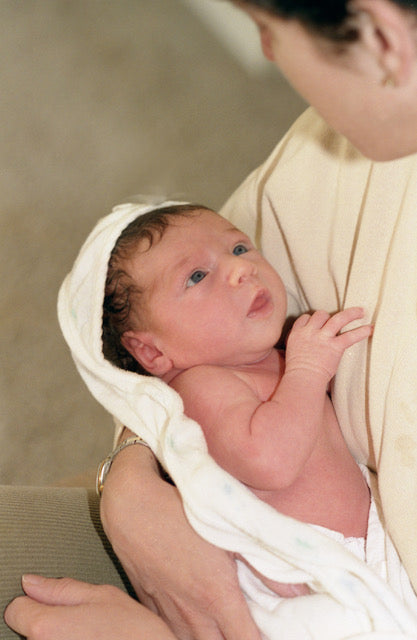 new mom and baby, post pregnancy, postnatal, postpartum, newborn, cuddles, bonding