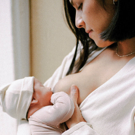 Woman breastfeeding her newborn baby