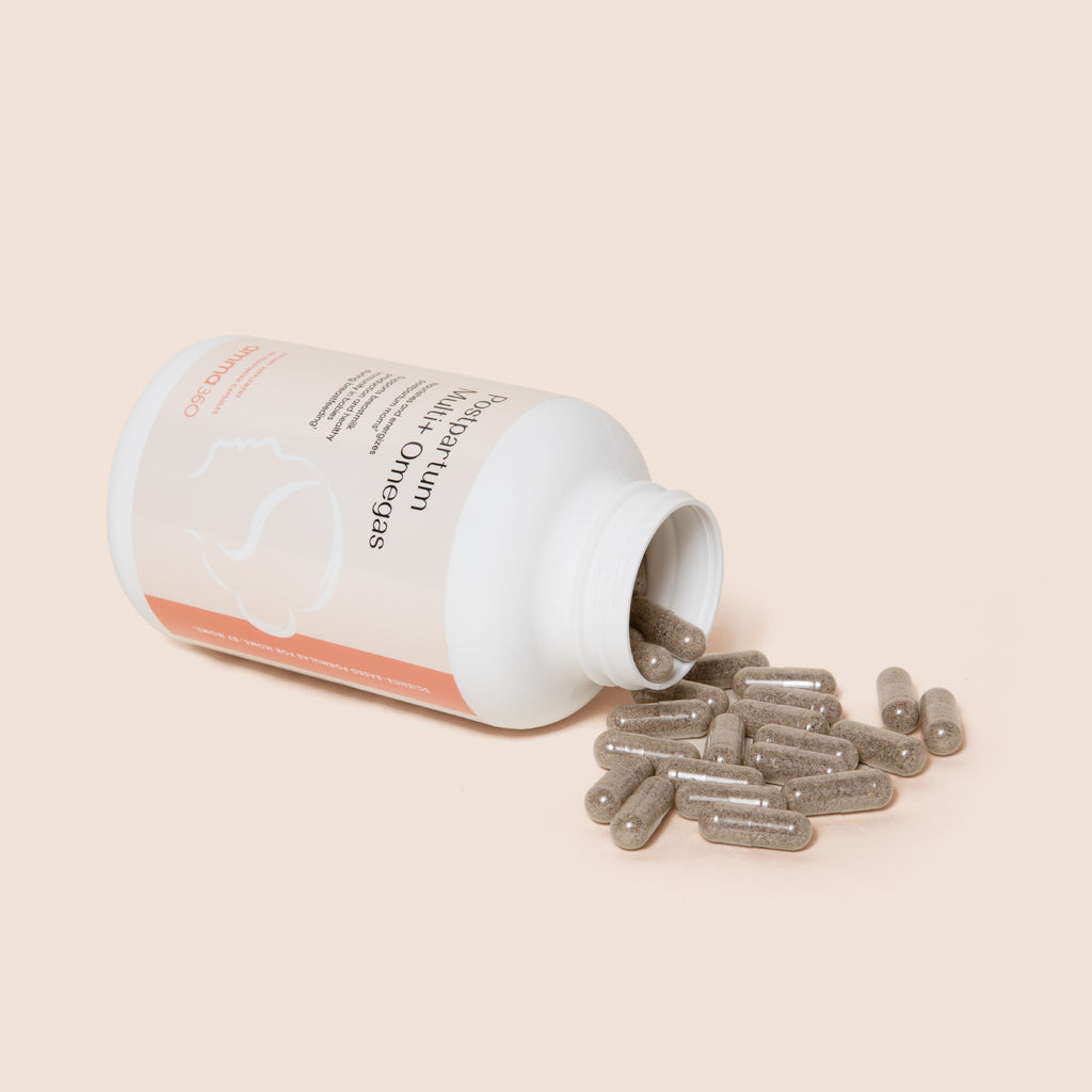 Product photo: Postpartum Multi+ Omegas capsules spilled on tabletop out of bottle. A comprehensive multivitamin formula with added omegas, and 12 essential minerals and vitamins to satisfy the unique and increased nutrient needs of postnatal moms. Nourishes and energizes postpartum moms. Supports breastmilk production and healthy immunity in babies during breastfeeding. 180 vegetarian capsules. Third party tested. Gluten free. Vegetarian. No fenugreek. Dietary supplements. Postnatal formula. amma360. 